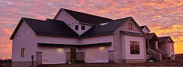 Standing Seam metal roof at sunset.